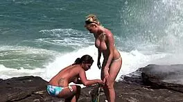 on the rock facing the sea we do a bit of hard cuddles