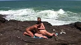 on the rock facing the sea we do a bit of hard cuddles