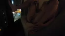 sharing private pleasure outdoors by hotel window