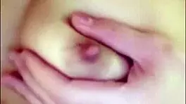 Chinese teen plays with tits