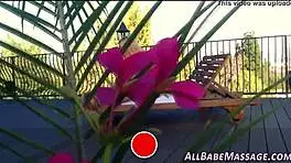 Lesbian watches as masseuse pleasures her client