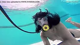 Brita piskova pleasures herself underwater in the pool, showing tits and ass