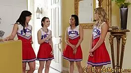 Cheerleader and teen engage in friendly rubbing activity