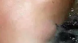 Sexy milf aggressively fucks her young boyfriend in the hot tub, showing off her big tits and ass.