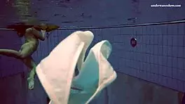 Petite 18+ brunette pornstar Alla swims naked in the hot pool, showing off her horny tits and ass while smoking