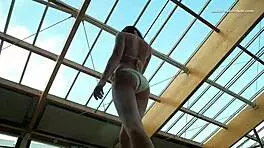 Petite 18+ brunette pornstar Alla swims naked in the hot pool, showing off her horny tits and ass while smoking