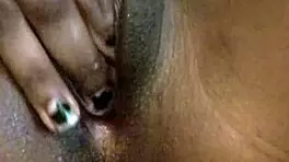 Skinny ebony teen plays with her tight, wet pussy all alone