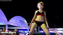 Hot Thai teen gives a sexy dance in bikini with upskirt views.