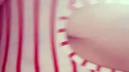 Teen masturbates to Christmas music, reaching orgasm.