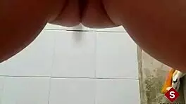 Warming up in the bathtub by inserting fingers