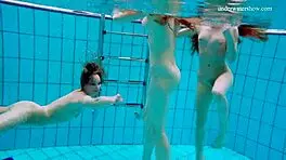 Avenna, Nina Mohnatka, and Marketa dive into steamy pool fun with bikini babes