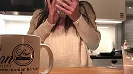 Young amateur wife does dishes while voyeur cam captures her in tight leggings and thong