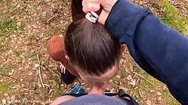 Russian couple captures unexpected intimate moment in the woods with ponytail and natural setting