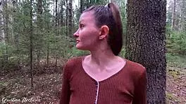 Russian couple captures unexpected intimate moment in the woods with ponytail and natural setting