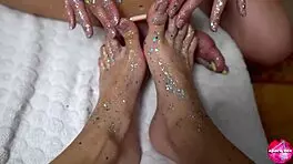 Two cute teens with shiny legs tease huge rubber cock in footjob play, amateurs explore toys