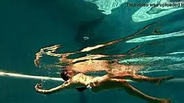 Irina's tight pussy gets wet in pool