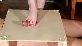 Watch domina stomp cock with bare feet! Footjob madness!