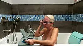 Stella indulges in a soothing bath with intimate shaving rituals