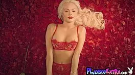 Hey, watch petite blonde Elsa Jean strip among red petals!