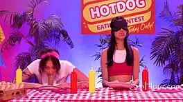 Dkye soaks her strapon at a wild hotdog eating contest.