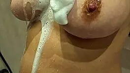 this young MILF with BIG TITS at 18-19 years old shows off her assets in a casual way