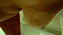 this young MILF with BIG TITS at 18-19 years old shows off her assets in a casual way