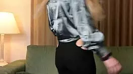 Hazel Ash models a shiny shirt with leggings in a casual photoshoot