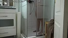 Stepson spies on stepmom’s morning shower, stroking hard.