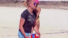 Young girl in micro bikini enjoys beach day with boyfriend's relatives