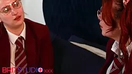 two redhead students in uniforms at a party