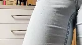 Petite Blonde Performs Seductive Striptease In Tight Jeans