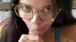 Nerdy brunette with natural tits and brown eyes gives deep blowjob to Wellington Prado's big cock in jeans shorts