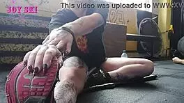 Alternative Girl Stretching At The Gym