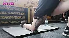 Alternative Girl Stretching At The Gym