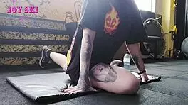 Alternative Girl Stretching At The Gym