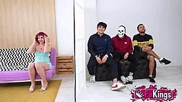 Young Mei, petite with short red hair, instructs three young dudes in a group lesson