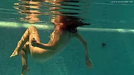 Irina Russaka Bathes Underwater In Pool, Showing Small Tits.