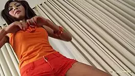 She jerks him off as cum sprays all over her young Asian chest and tits