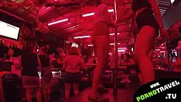 Horny petite 18+ brunette shakes ass at bar in sneakers for group swingers