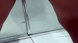 Teen bends over for juicy squirt in bathroom stall