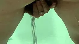 Teen bends over for juicy squirt in bathroom stall