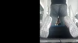 Skinny Mexican teen bent over in leggings at the gym