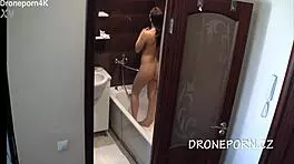 Cute teen aurora spied on in the shower, her small tits exposed as she bathes secretly.