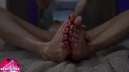 Teen girl plays with oiled feet in close-up fetish