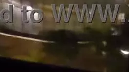 Milf masturbates in front of hotel window.