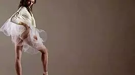 Blonde gymnast just casually showing off moves in a naked workout.