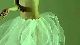 Blonde gymnast just casually showing off moves in a naked workout.