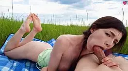 Cute girl enjoys deepthroat snack outdoors