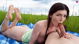 Cute girl enjoys deepthroat snack outdoors