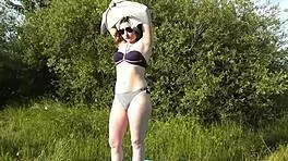 yo, this cute brunette babe strips naked on a wild public beach!